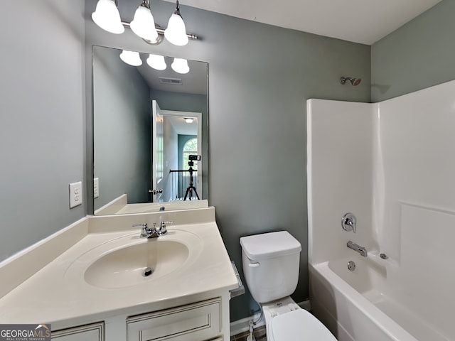 3507 Hideaway Ln, Loganville, GA 30052 - bathroom featuring toilet, vanity, and shower / tub combination