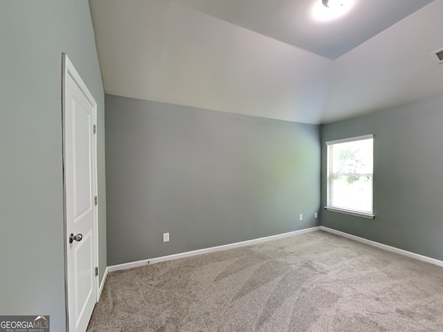 3507 Hideaway Ln, Loganville, GA 30052 - empty room featuring lofted ceiling, carpet flooring, and baseboards