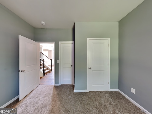 3507 Hideaway Ln, Loganville, GA 30052 - unfurnished bedroom with carpet floors and baseboards