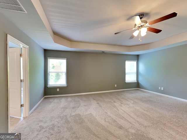 3507 Hideaway Ln, Loganville, GA 30052 - spare room featuring carpet flooring, baseboards, ceiling fan, and a raised ceiling