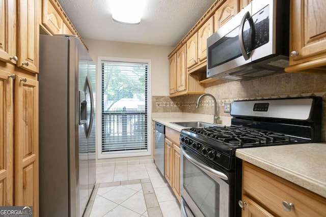 408 River Run Dr, Sandy Springs, GA 30350 - kitchen featuring stainless steel appliances, a sink, backsplash, light tile patterned flooring, and light countertops