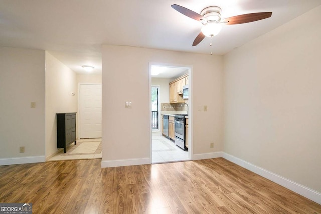 408 River Run Dr, Sandy Springs, GA 30350 - empty room featuring ceiling fan, light wood-type flooring, and baseboards