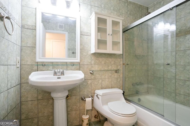 408 River Run Dr, Sandy Springs, GA 30350 - full bath featuring tile walls, shower / bath combination with glass door, and toilet