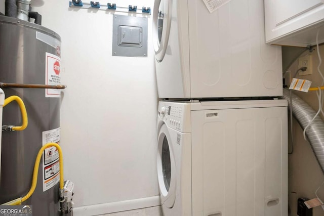 408 River Run Dr, Sandy Springs, GA 30350 - laundry room with gas water heater, stacked washer and clothes dryer, cabinet space, and electric panel