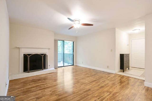 408 River Run Dr, Sandy Springs, GA 30350 - unfurnished living room with ceiling fan, wood finished floors, baseboards, and a fireplace with raised hearth