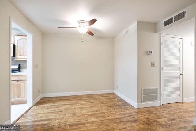 408 River Run Dr, Sandy Springs, GA 30350 - empty room with a ceiling fan, light wood finished floors, and baseboards
