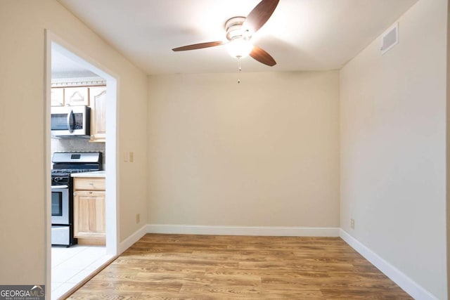 408 River Run Dr, Sandy Springs, GA 30350 - unfurnished room featuring a ceiling fan, light wood finished floors, and baseboards