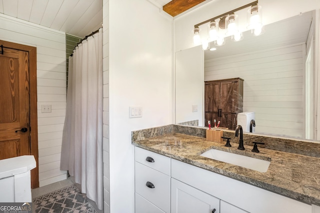 121 Samples Rd, Forsyth, GA 31029 - bathroom featuring vanity, wooden walls, and curtained shower