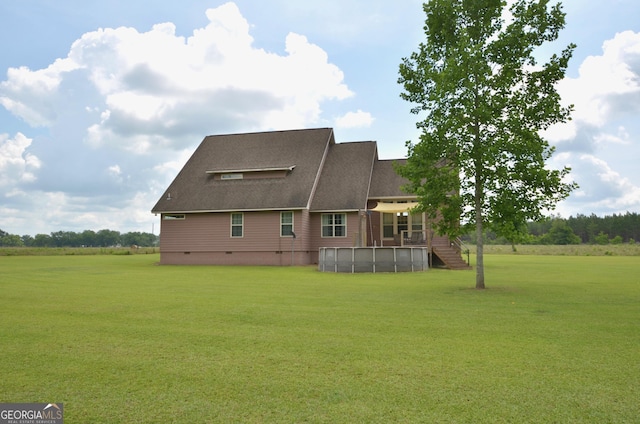 2025 Chicken Rd, Dudley, GA 31022 - rear view of property featuring a yard, crawl space, and roof with shingles