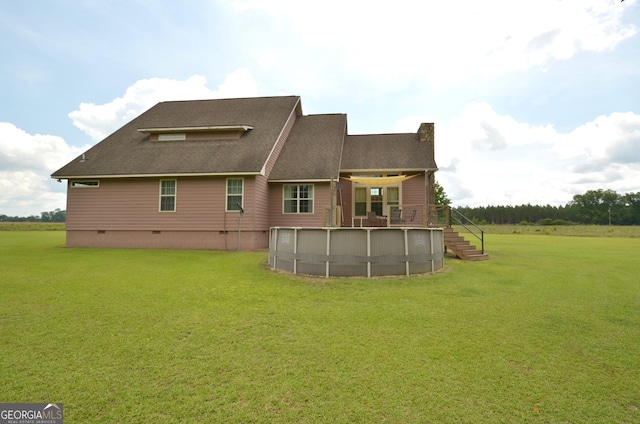 2025 Chicken Rd, Dudley, GA 31022 - rear view of property featuring an outdoor pool, a lawn, and crawl space