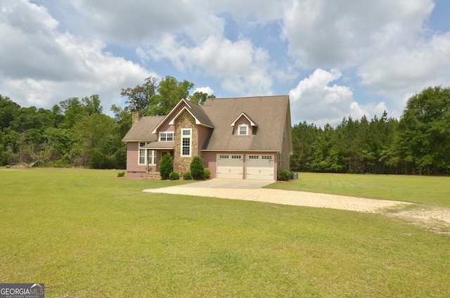 2025 Chicken Rd, Dudley, GA 31022 - view of front of property with gravel driveway, a front lawn, an attached garage, and stone siding