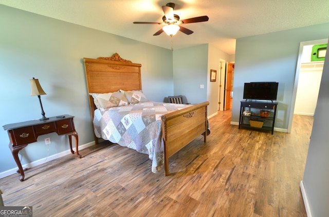 2025 Chicken Rd, Dudley, GA 31022 - bedroom with wood finished floors, baseboards, and ceiling fan
