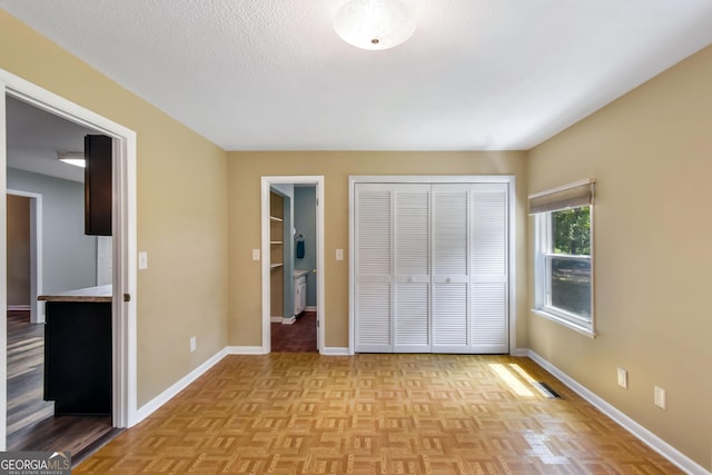 1069 Shellman Hammock Dr NE, Townsend, GA 31331 - unfurnished bedroom with a closet, baseboards, and a textured ceiling