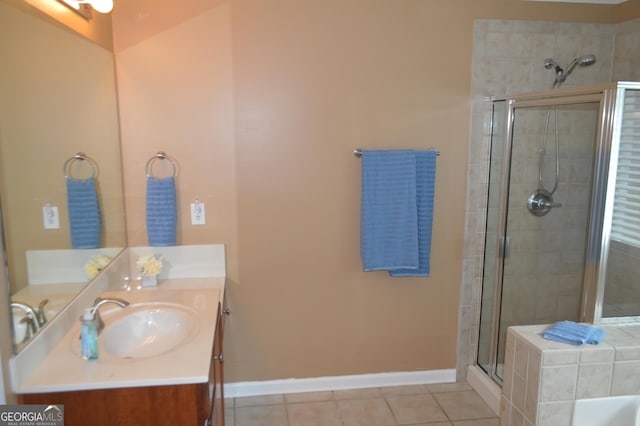 5427 Woodstream Ct, Gainesville, GA 30507 - full bathroom featuring a stall shower, tile patterned flooring, vanity, baseboards, and a tub to relax in