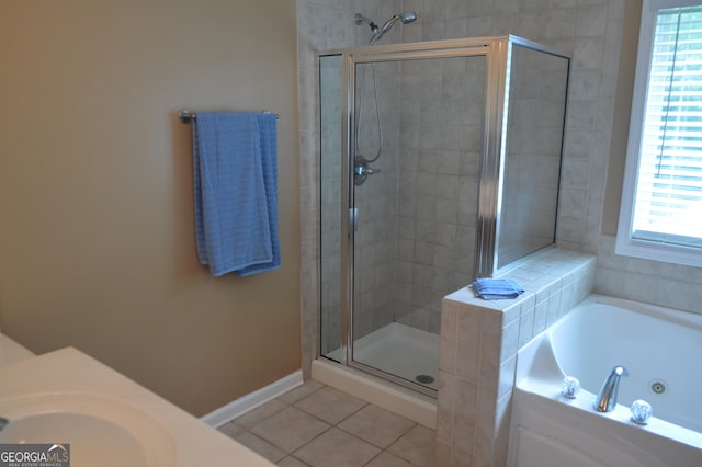 5427 Woodstream Ct, Gainesville, GA 30507 - full bath featuring a stall shower, a tub with jets, tile patterned floors, a sink, and baseboards