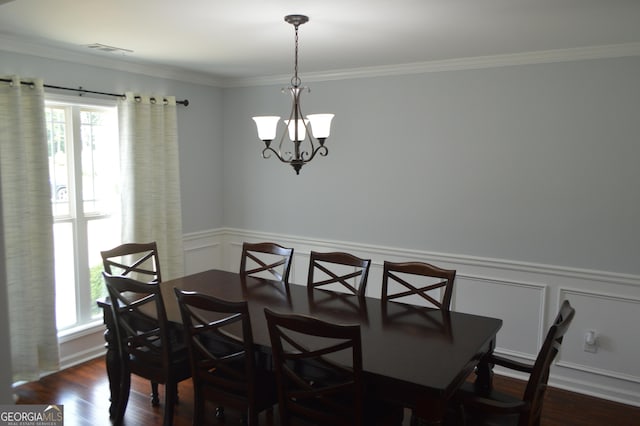 5427 Woodstream Ct, Gainesville, GA 30507 - dining area with a chandelier, a decorative wall, crown molding, dark wood finished floors, and a wainscoted wall