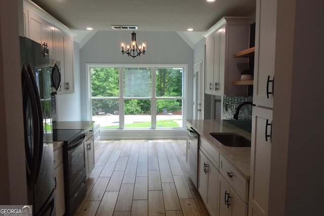5427 Woodstream Ct, Gainesville, GA 30507 - kitchen with black appliances, a sink, open shelves, lofted ceiling, and white cabinetry