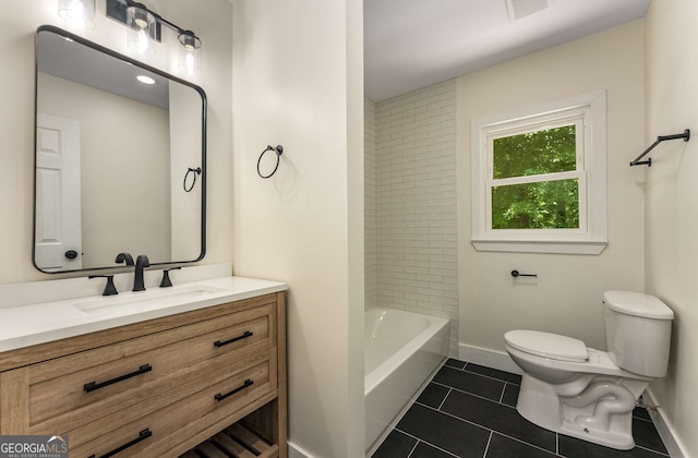 1364 Willis Mill Rd SW, Atlanta, GA 30311 - full bath with toilet, vanity, tile patterned flooring, baseboards, and shower / bath combination