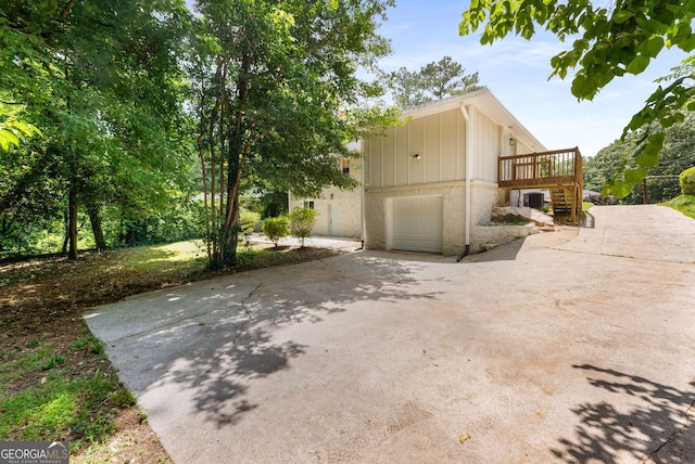 1364 Willis Mill Rd SW, Atlanta, GA 30311 - view of side of property featuring driveway, a garage, and stairs