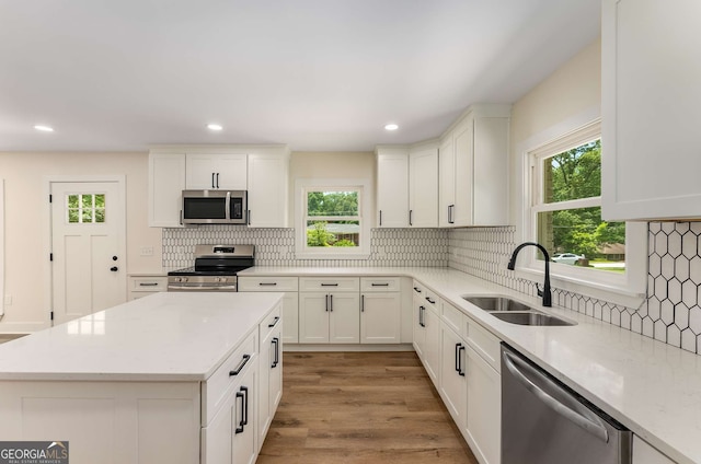 1364 Willis Mill Rd SW, Atlanta, GA 30311 - kitchen featuring appliances with stainless steel finishes, a sink, plenty of natural light, backsplash, and recessed lighting