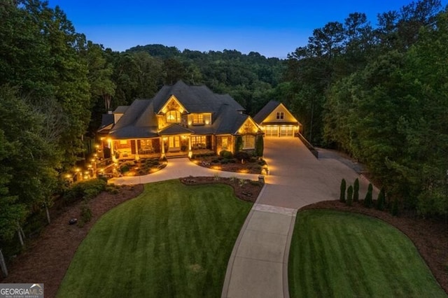 37 Retreat Rdg, Cartersville, GA 30120 - view of front of property with a view of trees, driveway, a front yard, and a garage