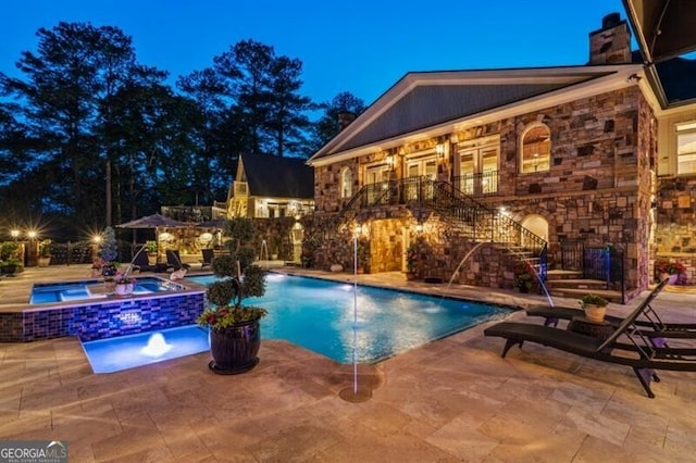 37 Retreat Rdg, Cartersville, GA 30120 - pool at night with stairway, a patio area, and a pool with connected hot tub