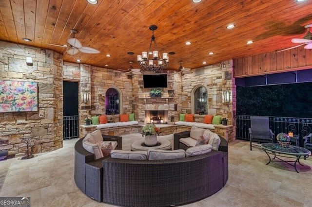 37 Retreat Rdg, Cartersville, GA 30120 - living room featuring an outdoor stone fireplace, wooden ceiling, recessed lighting, ceiling fan, and a chandelier