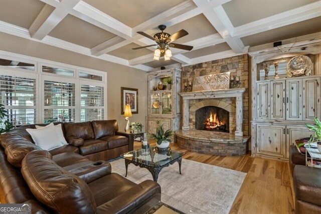 37 Retreat Rdg, Cartersville, GA 30120 - living room with wood finished floors, ceiling fan, a fireplace, coffered ceiling, and beamed ceiling