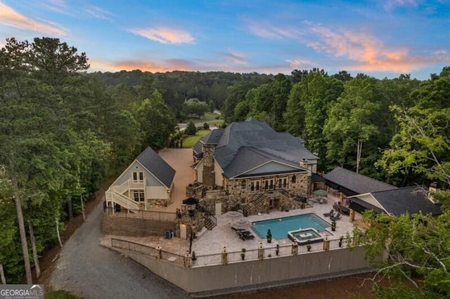 37 Retreat Rdg, Cartersville, GA 30120 - aerial view at dusk of a wooded view and view of pool area