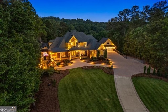 37 Retreat Rdg, Cartersville, GA 30120 - view of front of home with a forest view, a front lawn, and concrete driveway