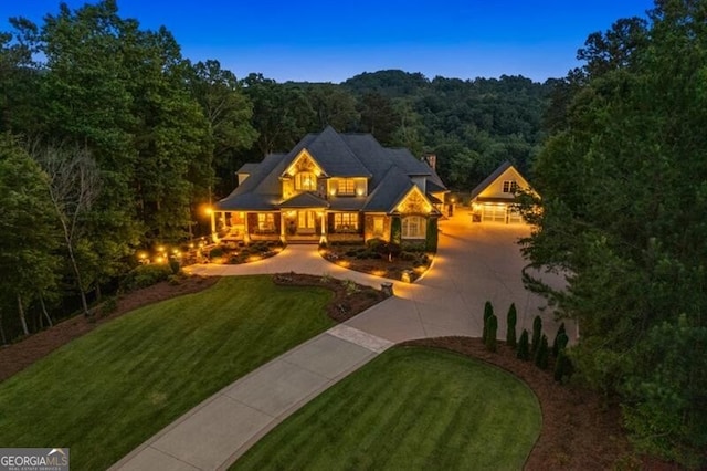 37 Retreat Rdg, Cartersville, GA 30120 - view of front facade with curved driveway, a view of trees, and a front lawn
