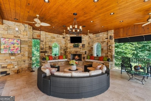 37 Retreat Rdg, Cartersville, GA 30120 - living area featuring wooden ceiling, a ceiling fan, an outdoor stone fireplace, recessed lighting, and light stone finish floors