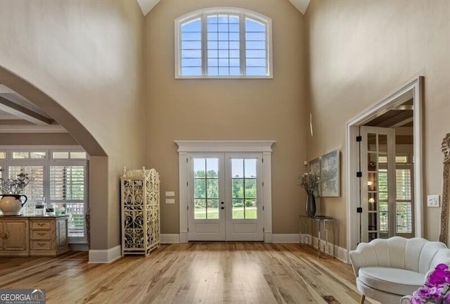37 Retreat Rdg, Cartersville, GA 30120 - entrance foyer featuring a high ceiling, french doors, light wood-style flooring, arched walkways, and healthy amount of natural light