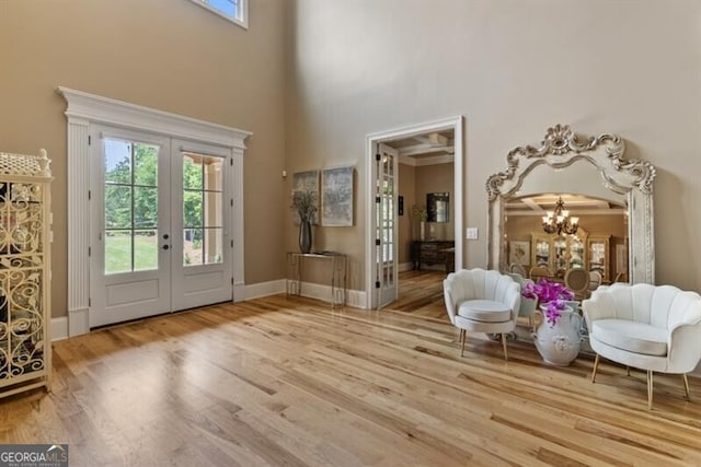 37 Retreat Rdg, Cartersville, GA 30120 - entrance foyer featuring french doors, a chandelier, a high ceiling, and wood finished floors