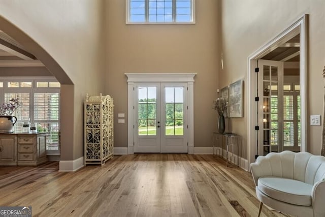 37 Retreat Rdg, Cartersville, GA 30120 - entryway featuring french doors, a high ceiling, light wood-style flooring, plenty of natural light, and arched walkways