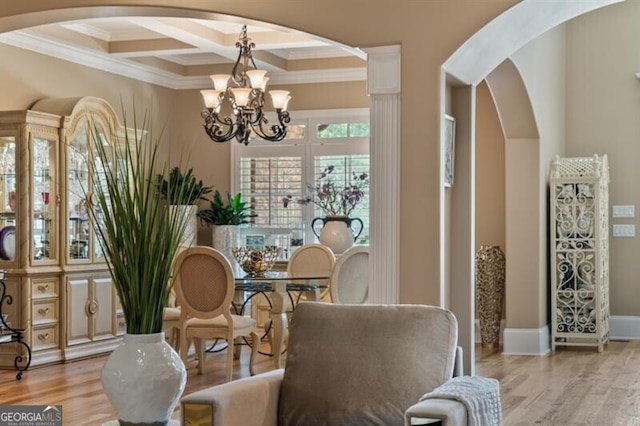37 Retreat Rdg, Cartersville, GA 30120 - sitting room with arched walkways, a chandelier, coffered ceiling, crown molding, and light wood finished floors