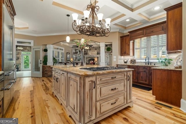 37 Retreat Rdg, Cartersville, GA 30120 - kitchen with stainless steel gas stovetop, crown molding, light wood-style floors, beamed ceiling, and open floor plan