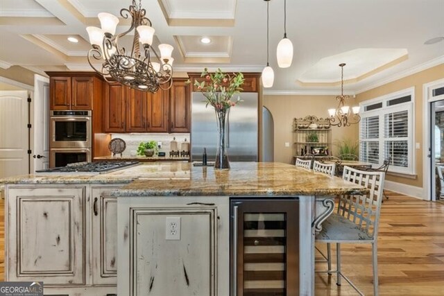 37 Retreat Rdg, Cartersville, GA 30120 - kitchen featuring beverage cooler, a chandelier, appliances with stainless steel finishes, crown molding, and light wood-style flooring