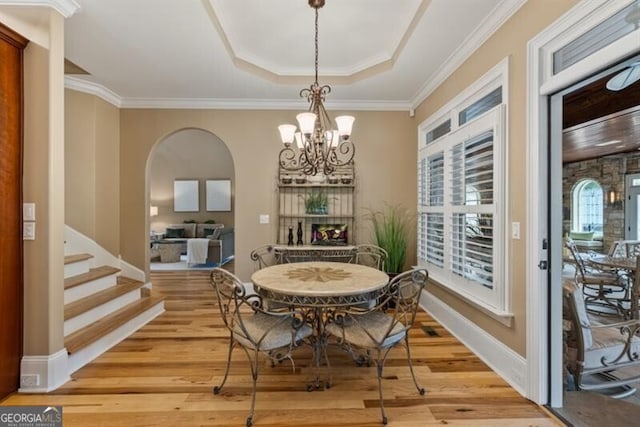 37 Retreat Rdg, Cartersville, GA 30120 - dining area with light wood finished floors, crown molding, a chandelier, arched walkways, and stairway