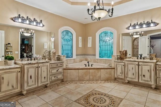 37 Retreat Rdg, Cartersville, GA 30120 - bathroom featuring a chandelier, two vanities, tile patterned floors, and a bath