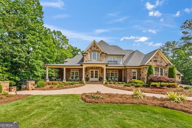 37 Retreat Rdg, Cartersville, GA 30120 - back of property featuring stone siding, a yard, a porch, and french doors