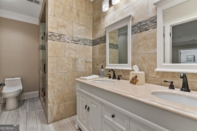 37 Retreat Rdg, Cartersville, GA 30120 - full bath with ornamental molding, double vanity, tile walls, a shower stall, and wood finished floors