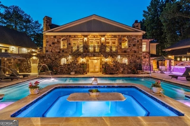 37 Retreat Rdg, Cartersville, GA 30120 - view of swimming pool with a pool with connected hot tub and a patio area