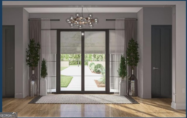0 Ebenezer Rd Unit 4, Fayetteville, GA 30215 - doorway featuring wood finished floors, a chandelier, and baseboards