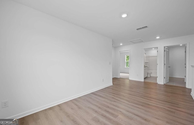 3044 Orwell Dr, Gainesville, GA 30507 - unfurnished bedroom featuring attic access, light wood finished floors, recessed lighting, baseboards, and ensuite bathroom