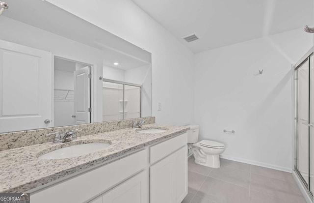 3044 Orwell Dr, Gainesville, GA 30507 - bathroom with a shower stall, double vanity, toilet, and baseboards