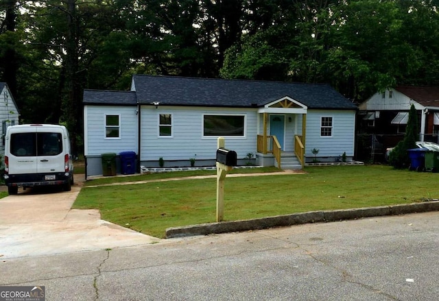 1227 Kenilworth Dr SW, Atlanta, GA 30310 - bungalow-style house featuring a front lawn and a shingled roof