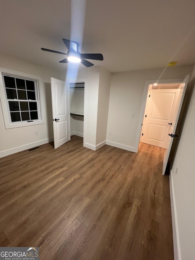 1227 Kenilworth Dr SW, Atlanta, GA 30310 - unfurnished bedroom featuring wood finished floors, baseboards, and a closet