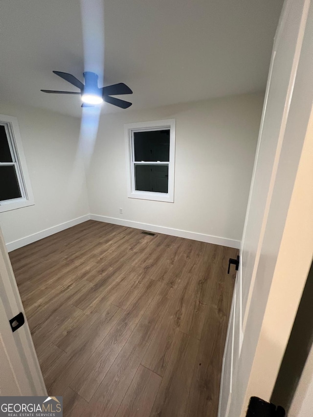 1227 Kenilworth Dr SW, Atlanta, GA 30310 - empty room with wood finished floors and a ceiling fan