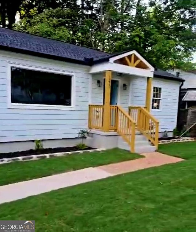 1227 Kenilworth Dr SW, Atlanta, GA 30310 - bungalow-style house with a front yard and roof with shingles